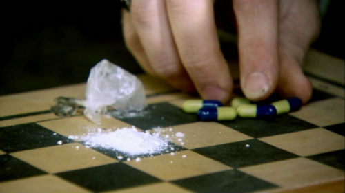 Drug pills on a chess board