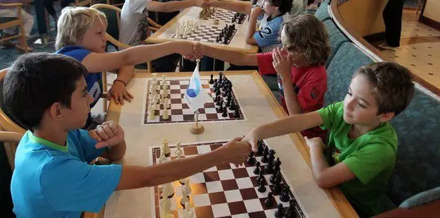 Kids Playing Chess In A Chess Tournament For Kids