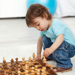 A Yound Kid Playing Chess