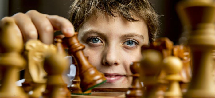 A Child Playing Chess