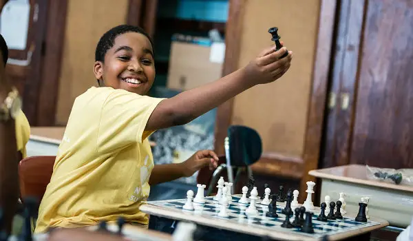 A happy student in a chess school