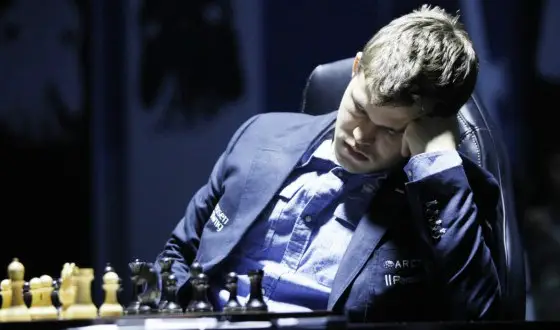 Margnus Carlsen falling asleep during a chess match