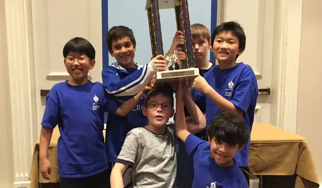 NSCF Students with their trophy after winning in a chess tournament